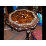 A heavily inlaid Indian style octagonal table -