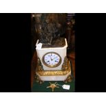 A decorative antique French mantel clock with figu