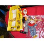 A boxed Pelham Puppet - Bimbo the clown - together with one other string puppet