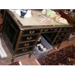 A 19th century brass bound writing desk with nine dr