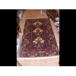 An antique Baluch rug - 155cm x 90cm