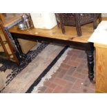 A Victorian stripped pine kitchen table on turned