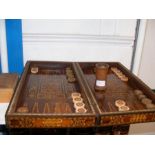 A backgammon board in parquetry box (also features