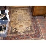 A antique Persian silk rug with geometric border -