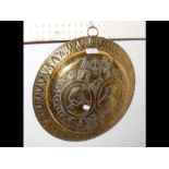 A relief work brass circular plaque - 36cm diamete