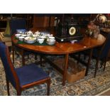 A retro Danish rosewood extending dining table wit