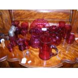 Selection of cranberry glass, including jug, vases