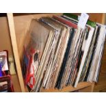 A collection of 7" and 12" vinyl records, includin