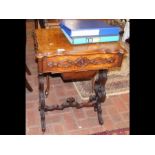 A Victorian walnut worktable with fitted interior