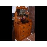 An antique dressing table with drawers below