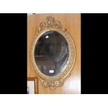 A decorative gilt hall mirror