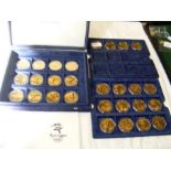 A collection of 28 5 dollar coins commemorating Sy