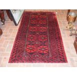 An antique Persian Shiraz rug with geometric borde