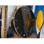 An oversized brushed brass and black wall clock - diameter 77cm