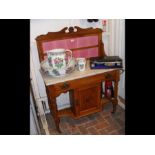 An Edwardian wash stand with marble top and tiled