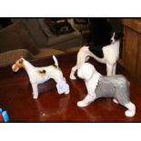 A Beswick dog ornament and two others