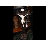 A carved wooden cross depicting the Crucifixion -