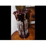 An antique red glass lustre