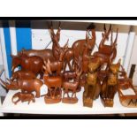 A quantity of carved wooden figures, mostly of ant