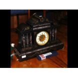 A slate and marble Victorian chiming mantel clock