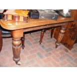 A Victorian mahogany winder extending dining table