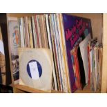 A collection of 7" and 12" vinyl records, includin