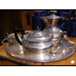 A four piece silver plated tea set with two handle