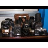A medley of vintage cameras and other optical equi