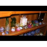 A collection of paperweights, including those by C