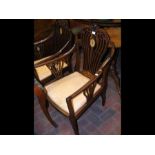 A pair of Edwardian inlaid mahogany armchairs with