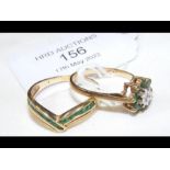 A 9ct gold ring set with diamonds and emeralds tog
