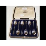 A cased set of six silver coffee spoons, case insc