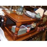 An antique style rectangular coffee table on turne