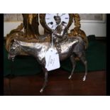 A 17cm high silver model of a horse and joc