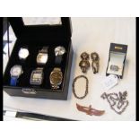 A case containing six assorted gents wrist watches