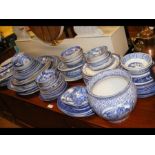 A generous quantity of blue and white tableware in
