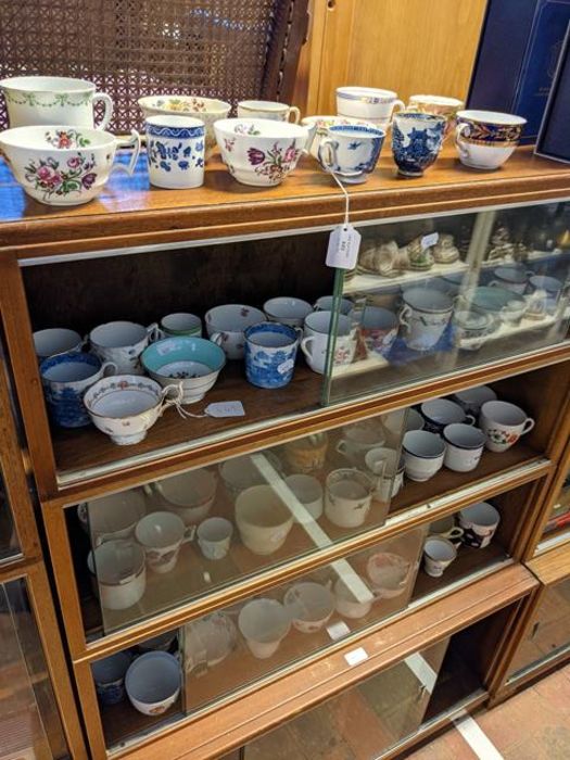 A medley of teacups - on four shelves