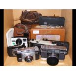 A collection of vintage cameras, including Coronet