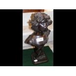 A bronze bust of female - 36cms high