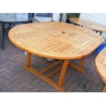 An oval garden table - length 180cms