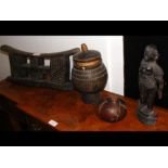 A collection of African artefacts, including a hea
