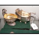 A silver cream jug and one other