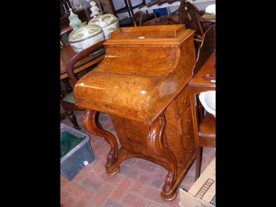 A Victorian walnut piano top Davenport with rising