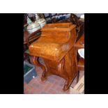 A Victorian walnut piano top Davenport with rising