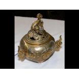 A Chinese cast brass incense pot and cover with sc
