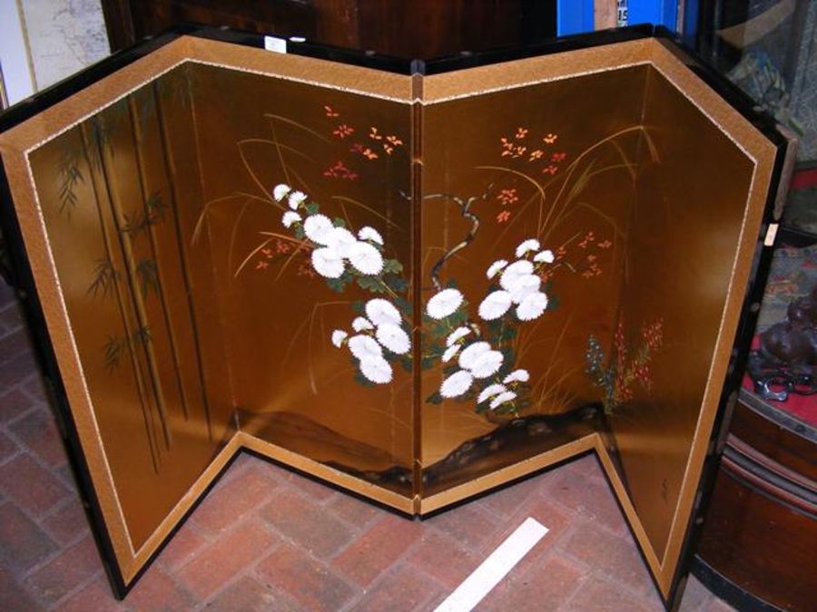 A four-fold oriental screen painted with bamboo an
