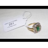 An 18ct yellow and white gold emerald and diamond