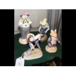 A Royal Worcester figure, Royal Doulton and two ot