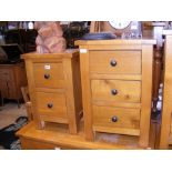 A modern light wood three drawer bedside cabinet,