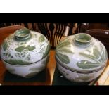 A pair of leaf pattern bowls and covers